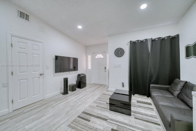 10000 SW 147th Ct, Miami, FL 33196 - living room with light wood-style floors, vaulted ceiling, and recessed lighting