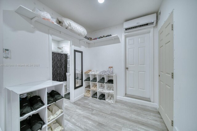 10000 SW 147th Ct, Miami, FL 33196 - mudroom with an AC wall unit and wood finished floors