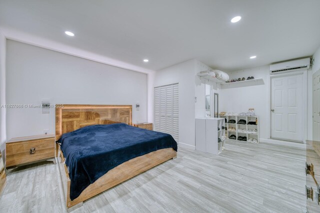10000 SW 147th Ct, Miami, FL 33196 - bedroom featuring a wall unit AC, wood finished floors, and recessed lighting