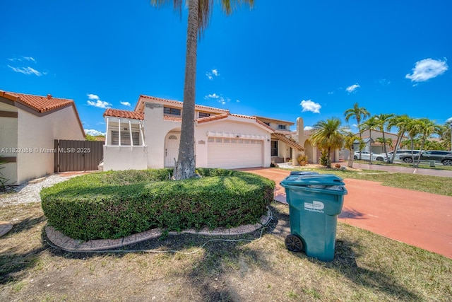 10000 SW 147th Ct, Miami, FL 33196 - mediterranean / spanish home with a tiled roof, an attached garage, and stucco siding