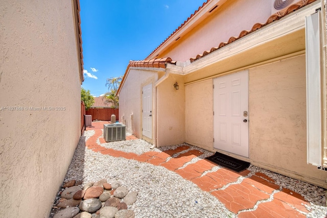 10000 SW 147th Ct, Miami, FL 33196 - view of exterior entry featuring stucco siding and a tiled roof