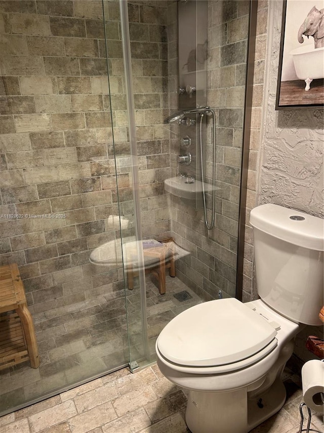 38 Northampton B 38, West Palm Beach, FL 33417 - bathroom with a stall shower and stone tile floors