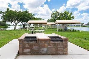 38 Northampton B 38, West Palm Beach, FL 33417 - view of property's community featuring a water view and a yard