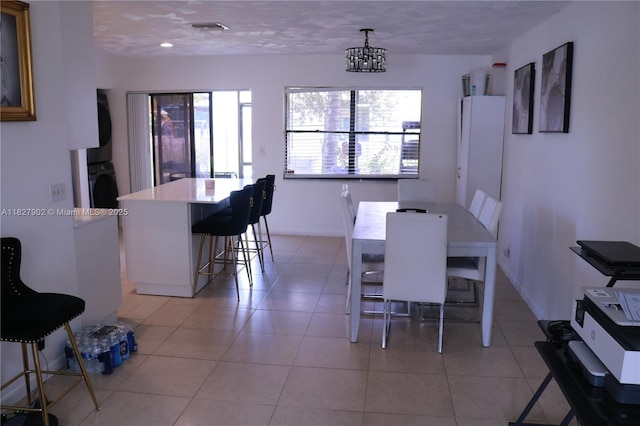 3370 Beau Rivage Dr, Pompano Beach, FL 33064 - dining space with stacked washer / drying machine, light tile patterned floors, and recessed lighting