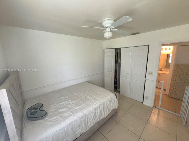 3370 Beau Rivage Dr, Pompano Beach, FL 33064 - bedroom with light tile patterned floors, a closet, and ceiling fan