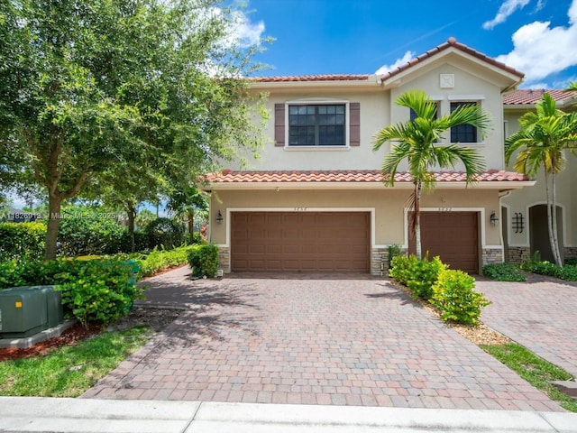 5656 NW 58th Ln, Tamarac, FL 33319 - view of front of home with stucco siding, stone siding, and a tile roof