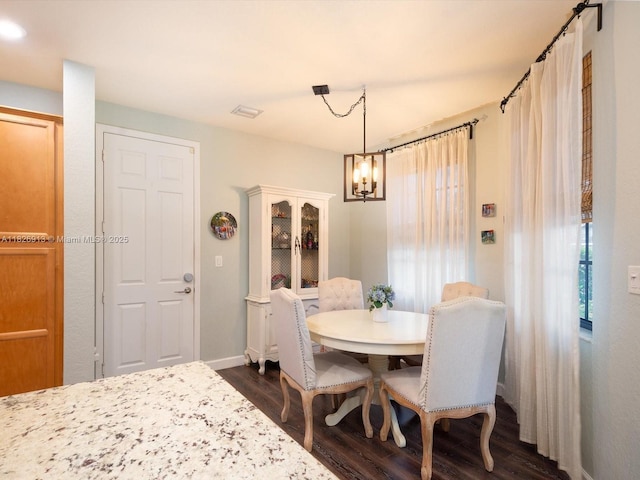 5656 NW 58th Ln, Tamarac, FL 33319 - dining area featuring a chandelier and dark wood-style floors