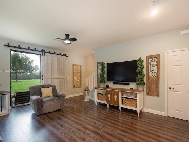 5656 NW 58th Ln, Tamarac, FL 33319 - living area featuring wood finished floors, a barn door, stairway, and ceiling fan