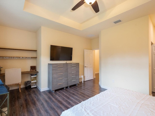 5656 NW 58th Ln, Tamarac, FL 33319 - bedroom with dark wood-type flooring, a tray ceiling, and a ceiling fan