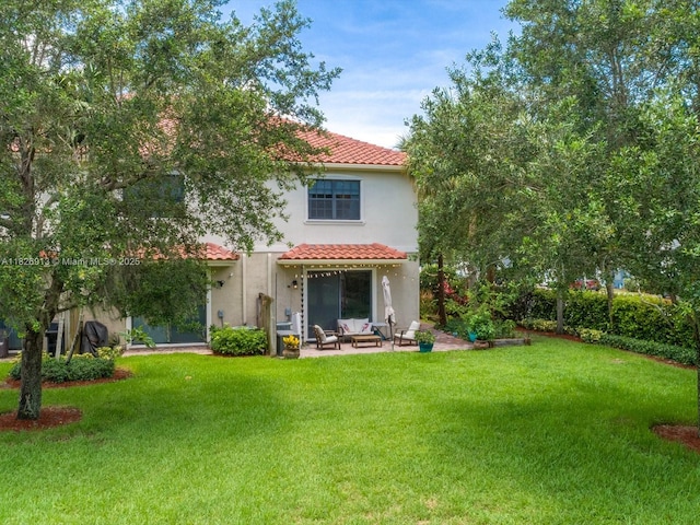 5656 NW 58th Ln, Tamarac, FL 33319 - rear view of property with a tiled roof, stucco siding, a yard, and a patio area