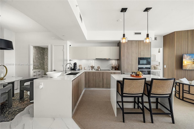 2900 NE 7th Ave Unit 2303, Miami, FL 33137 - kitchen featuring modern cabinets, oven, black microwave, and a breakfast bar area