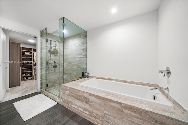 2900 NE 7th Ave Unit 2303, Miami, FL 33137 - full bath featuring a stall shower, a garden tub, a spacious closet, and recessed lighting