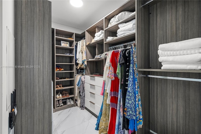 2900 NE 7th Ave Unit 2303, Miami, FL 33137 - walk in closet featuring marble look tile flooring