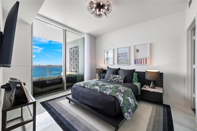 2900 NE 7th Ave Unit 2303, Miami, FL 33137 - bedroom featuring access to outside, light marble finish flooring, a water view, multiple windows, and floor to ceiling windows