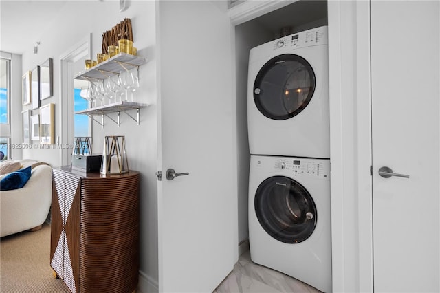2900 NE 7th Ave Unit 2303, Miami, FL 33137 - laundry room featuring stacked washer and clothes dryer and baseboards