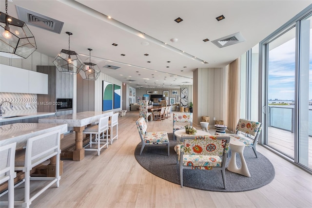 2900 NE 7th Ave Unit 2303, Miami, FL 33137 - dining space with floor to ceiling windows and light wood-type flooring