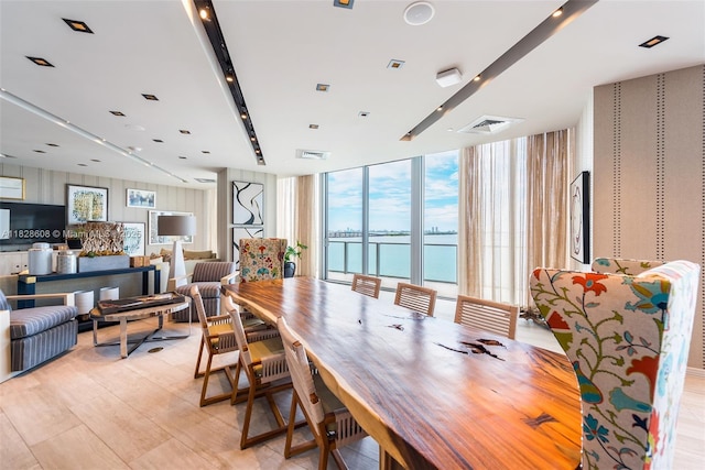 2900 NE 7th Ave Unit 2303, Miami, FL 33137 - dining area with light wood-style floors, floor to ceiling windows, and a water view