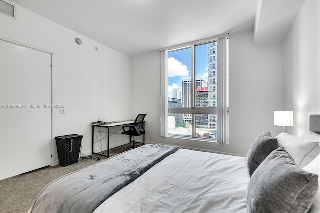 300 S Biscayne Blvd Unit T-1403, Miami, FL 33131 - bedroom with a skyline view and carpet flooring