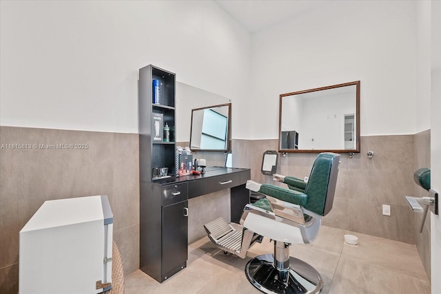 16675 C 24 Canal Rd, Port St Lucie, FL 34987 - home office featuring tile walls, light tile patterned flooring, and a wainscoted wall