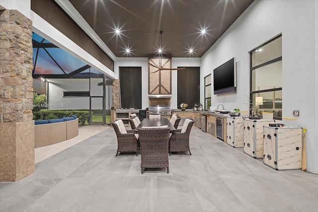 16675 C 24 Canal Rd, Port St Lucie, FL 34987 - view of patio / terrace featuring area for grilling, outdoor dining space, glass enclosure, and beverage cooler