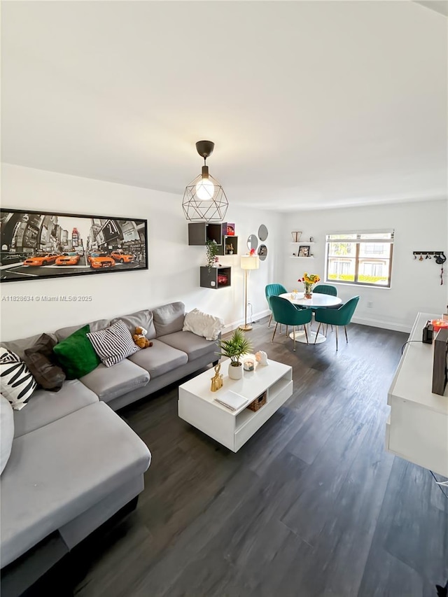 22551 SW 88th Pl Unit 205, Cutler Bay, FL 33190 - living room featuring dark wood finished floors and baseboards