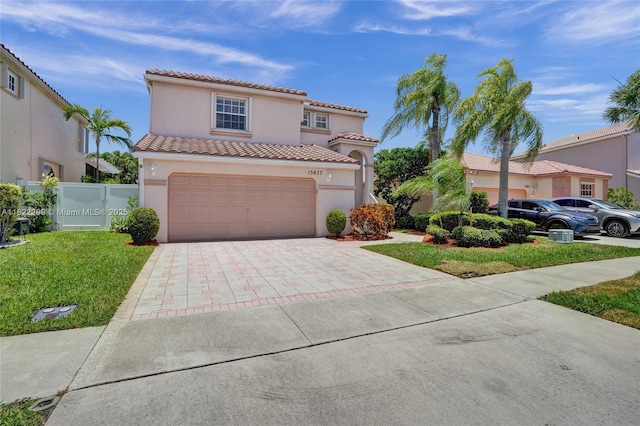15827 NW 4th Ct, Pembroke Pines, FL 33028 - mediterranean / spanish house featuring a tiled roof, stucco siding, driveway, and a garage