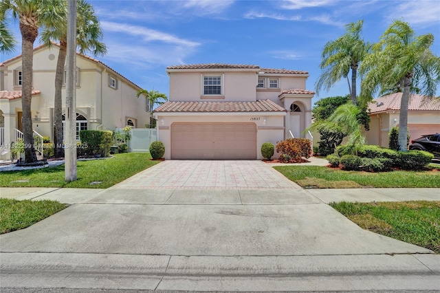 15827 NW 4th Ct, Pembroke Pines, FL 33028 - mediterranean / spanish-style home with a tile roof, stucco siding, concrete driveway, and a garage