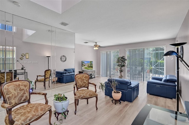 15827 NW 4th Ct, Pembroke Pines, FL 33028 - living area featuring light wood-style flooring and a ceiling fan