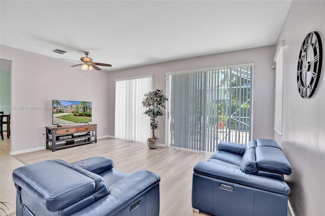 15827 NW 4th Ct, Pembroke Pines, FL 33028 - living area with plenty of natural light, a ceiling fan, and wood finished floors