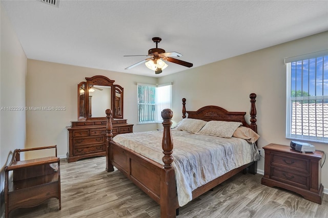 15827 NW 4th Ct, Pembroke Pines, FL 33028 - bedroom with light wood-style flooring and a ceiling fan