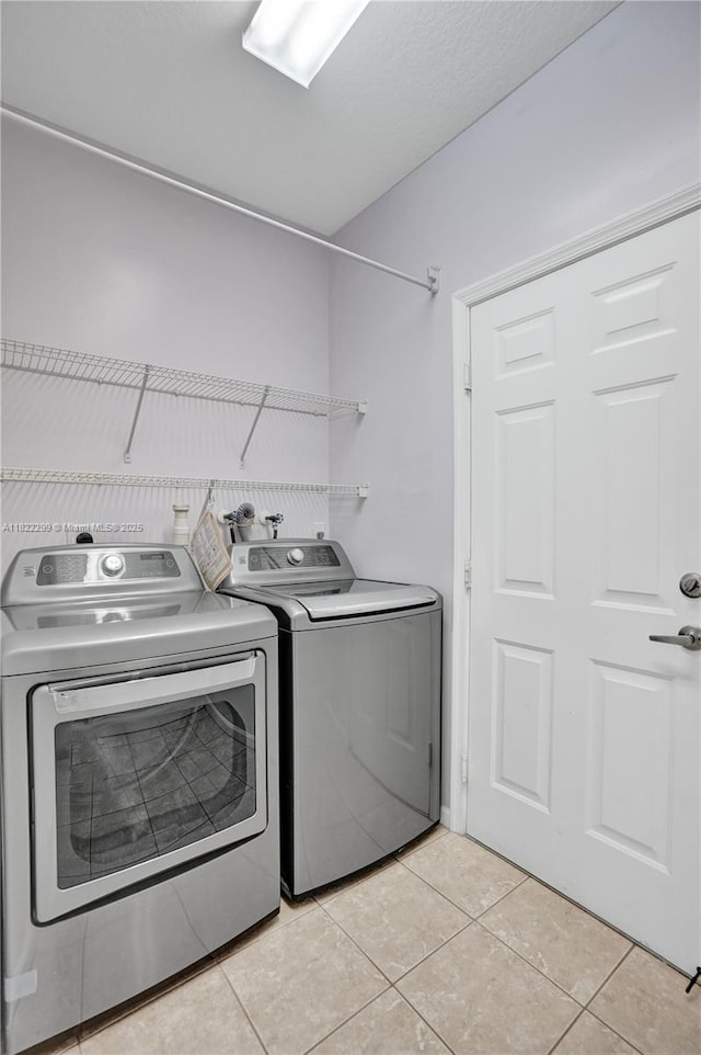 15827 NW 4th Ct, Pembroke Pines, FL 33028 - laundry room featuring washing machine and clothes dryer and light tile patterned flooring