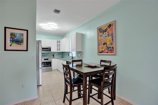 15827 NW 4th Ct, Pembroke Pines, FL 33028 - dining room with light tile patterned floors and baseboards