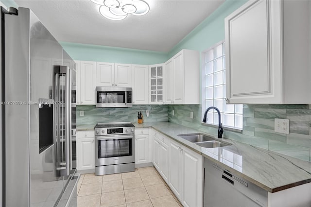 15827 NW 4th Ct, Pembroke Pines, FL 33028 - kitchen with appliances with stainless steel finishes, white cabinets, and light stone counters