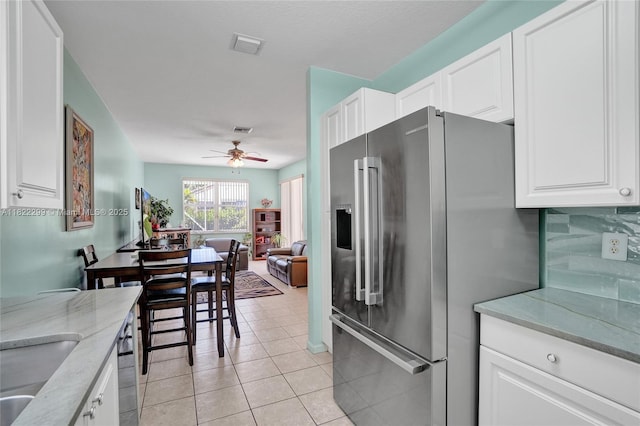 15827 NW 4th Ct, Pembroke Pines, FL 33028 - kitchen with high end fridge, ceiling fan, white cabinets, light stone counters, and open floor plan
