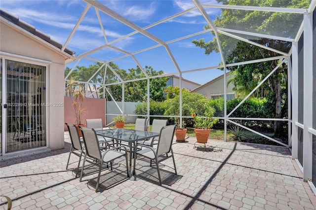 15827 NW 4th Ct, Pembroke Pines, FL 33028 - view of patio / terrace with glass enclosure and outdoor dining space
