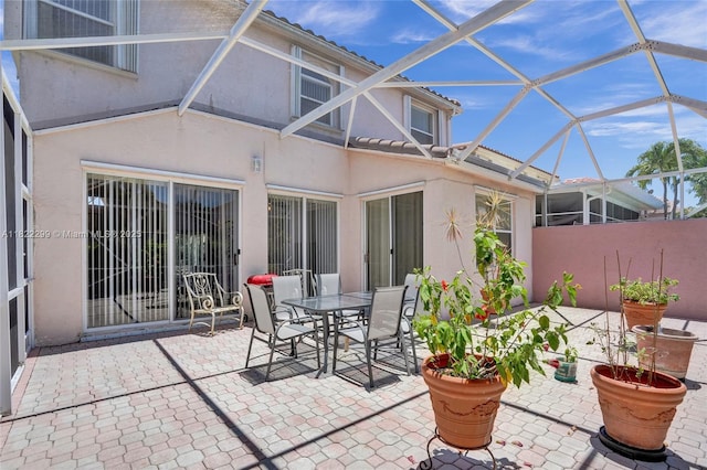 15827 NW 4th Ct, Pembroke Pines, FL 33028 - view of patio / terrace with glass enclosure and outdoor dining area