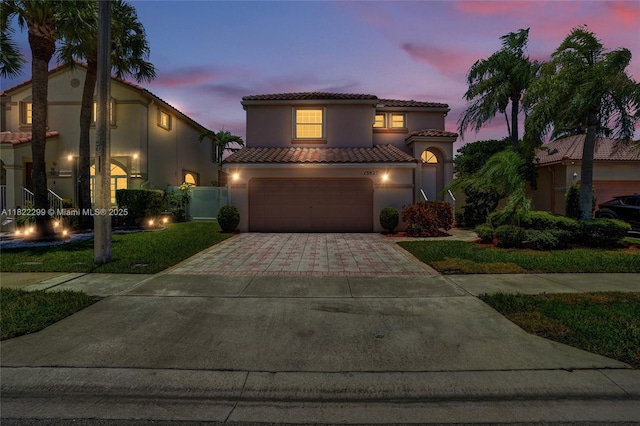 15827 NW 4th Ct, Pembroke Pines, FL 33028 - mediterranean / spanish-style home with stucco siding, a tile roof, driveway, and an attached garage