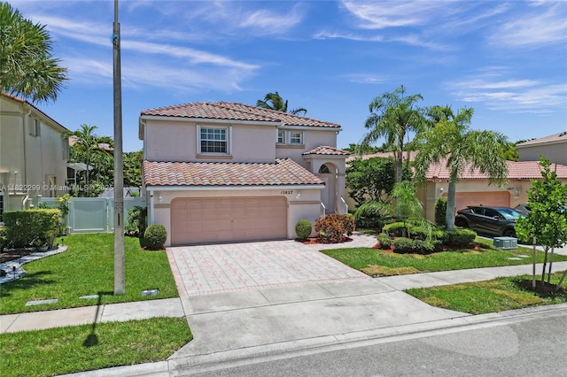 15827 NW 4th Ct, Pembroke Pines, FL 33028 - mediterranean / spanish house featuring stucco siding, a tile roof, an attached garage, and driveway