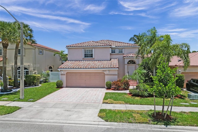 15827 NW 4th Ct, Pembroke Pines, FL 33028 - mediterranean / spanish home featuring a tiled roof, driveway, stucco siding, and an attached garage