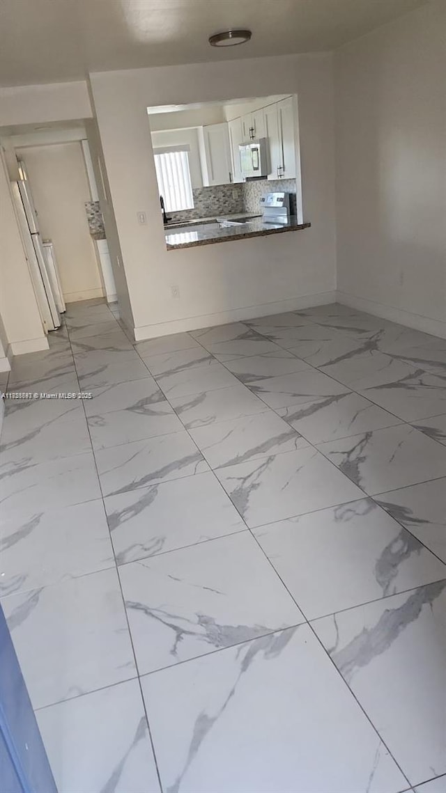 14902 SW 82nd Ln Unit 13-101, Miami, FL 33193 - spare room featuring light marble finish floors