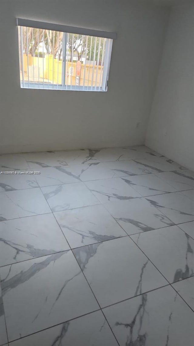 14902 SW 82nd Ln Unit 13-101, Miami, FL 33193 - unfurnished room with marble finish floors