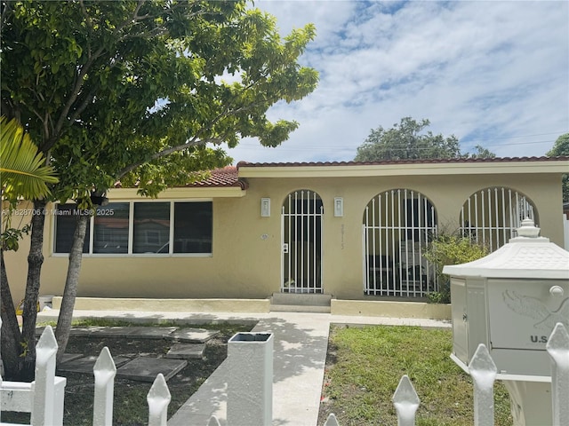 3915 NW 4th Ter, Miami, FL 33126 - view of front of home with stucco siding and a tile roof