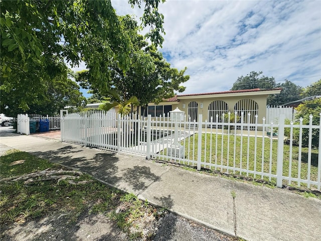 3915 NW 4th Ter, Miami, FL 33126 - view of front of property featuring stucco siding and a fenced front yard