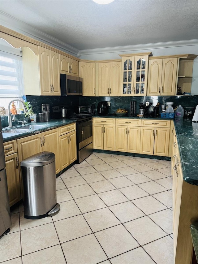 3915 NW 4th Ter, Miami, FL 33126 - kitchen featuring appliances with stainless steel finishes, tasteful backsplash, dark countertops, light brown cabinets, and crown molding