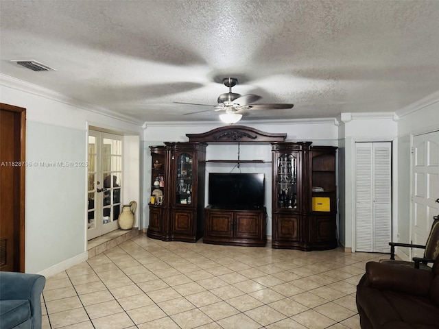 3915 NW 4th Ter, Miami, FL 33126 - living room with crown molding, a textured ceiling, ceiling fan, french doors, and light tile patterned floors