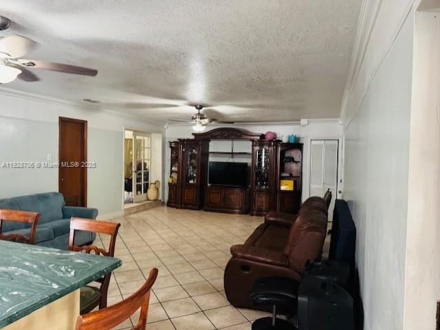 3915 NW 4th Ter, Miami, FL 33126 - living room with a ceiling fan, light tile patterned floors, a textured ceiling, and crown molding