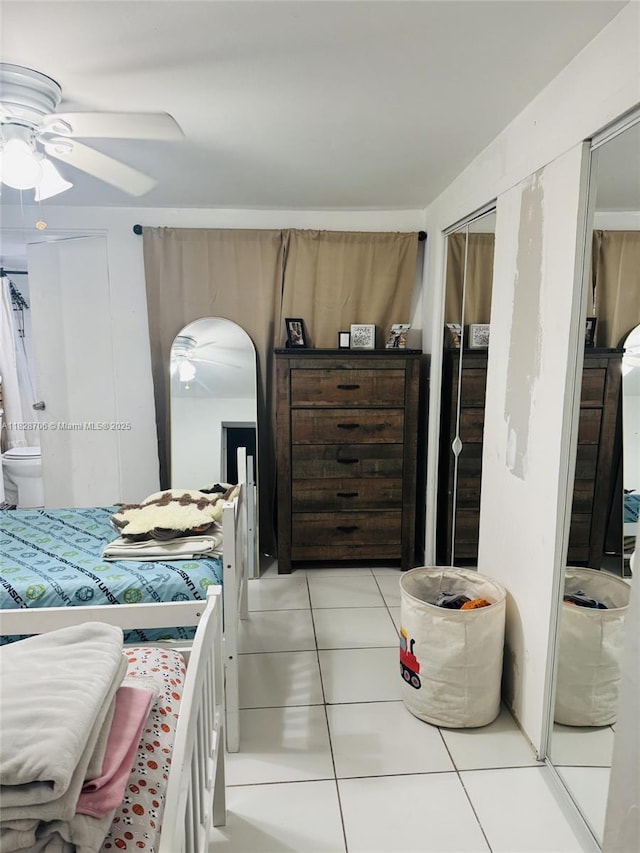 3915 NW 4th Ter, Miami, FL 33126 - bedroom with light tile patterned floors, a closet, a ceiling fan, and arched walkways