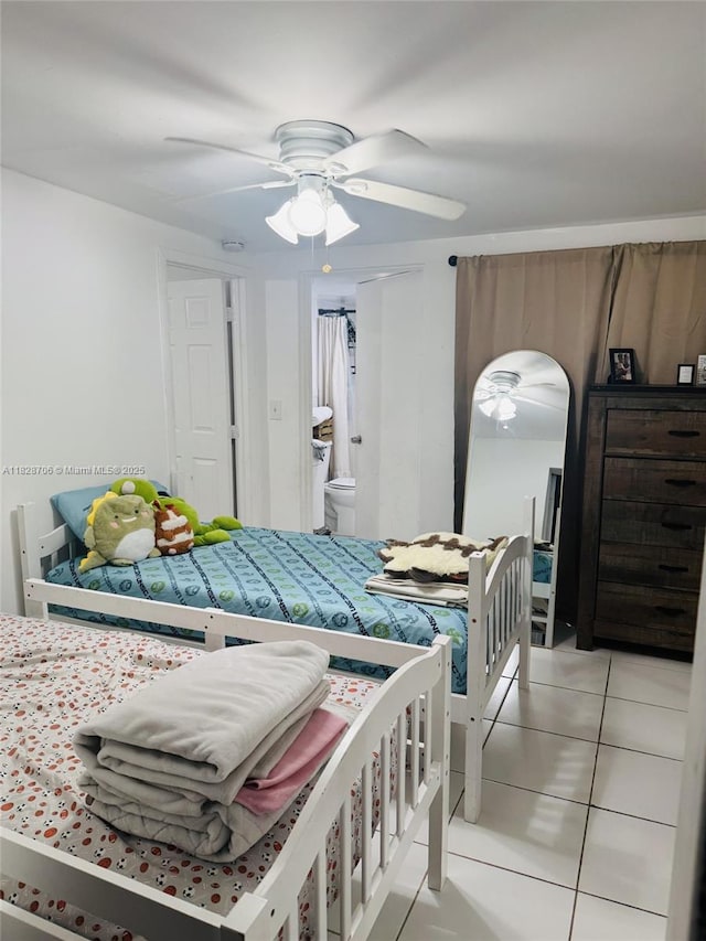 3915 NW 4th Ter, Miami, FL 33126 - bedroom with light tile patterned floors, a ceiling fan, and arched walkways