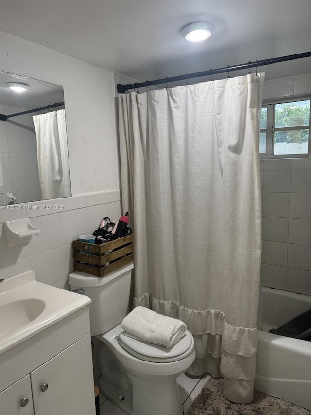 3915 NW 4th Ter, Miami, FL 33126 - bathroom featuring vanity, shower / tub combo, and tile walls