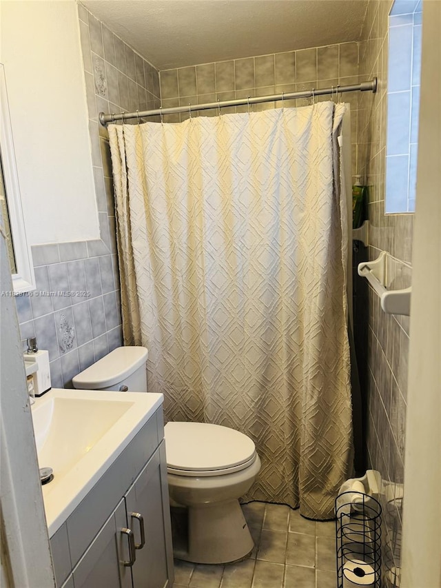 3915 NW 4th Ter, Miami, FL 33126 - bathroom featuring tile walls, tile patterned floors, vanity, and a shower with shower curtain
